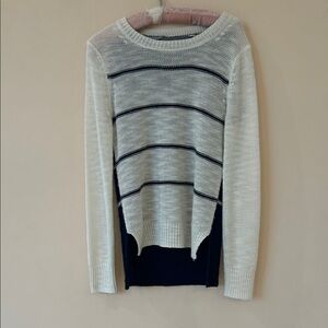 Navy and white crew neck sweater.